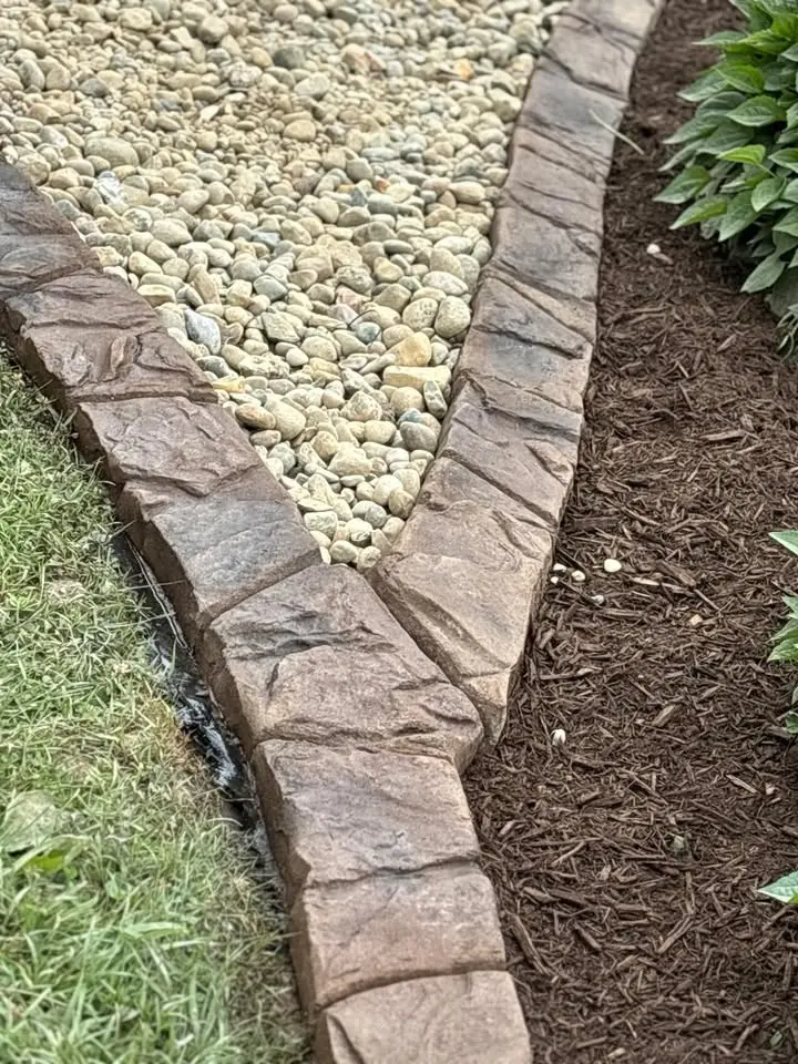 Custom concrete curbing along flower bed
