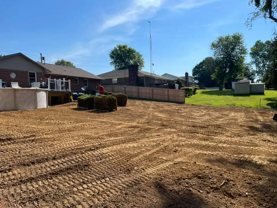 Graded and prepped lot with curbing and dirt work performed by The Muscle
